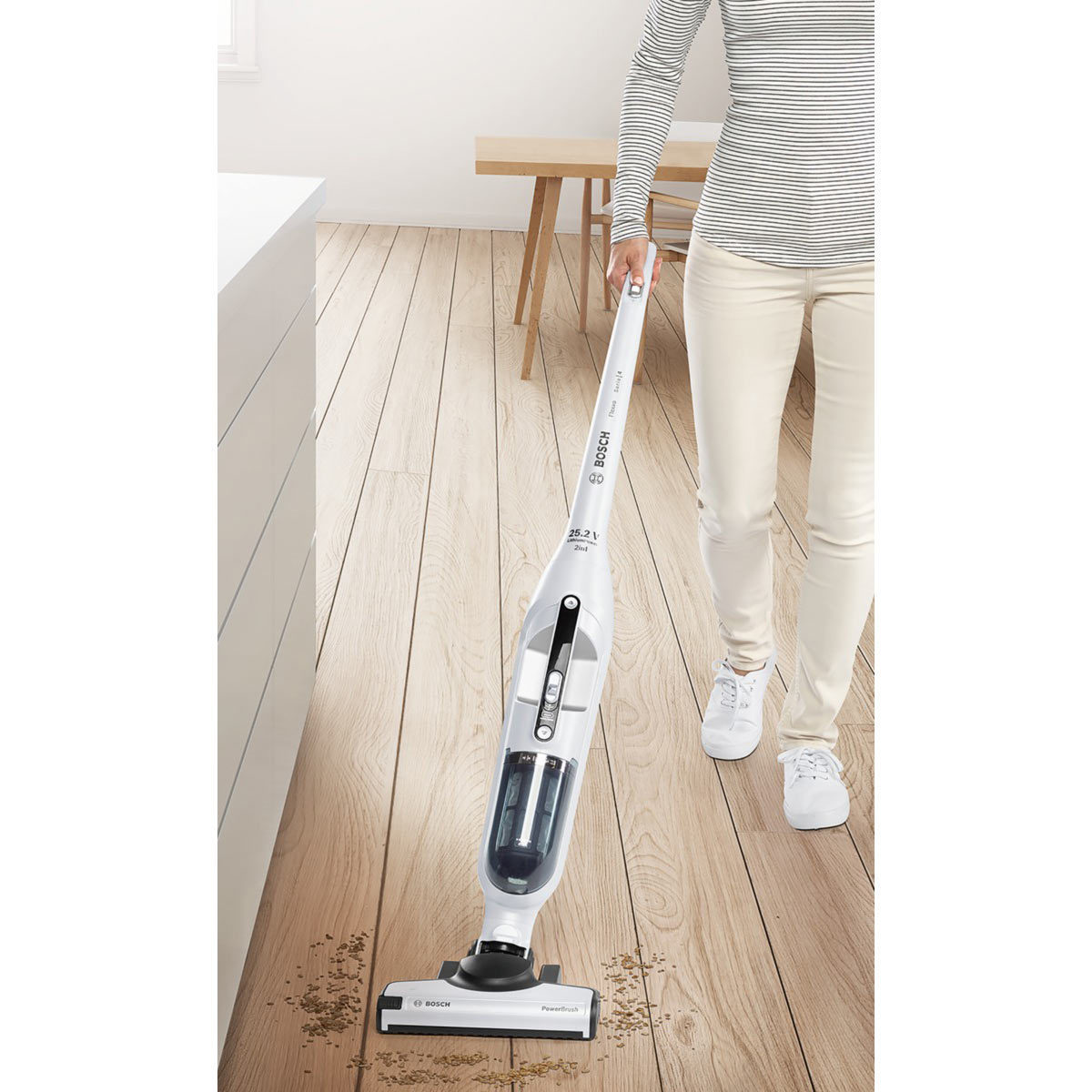 Image of model vaccuming on hard floor