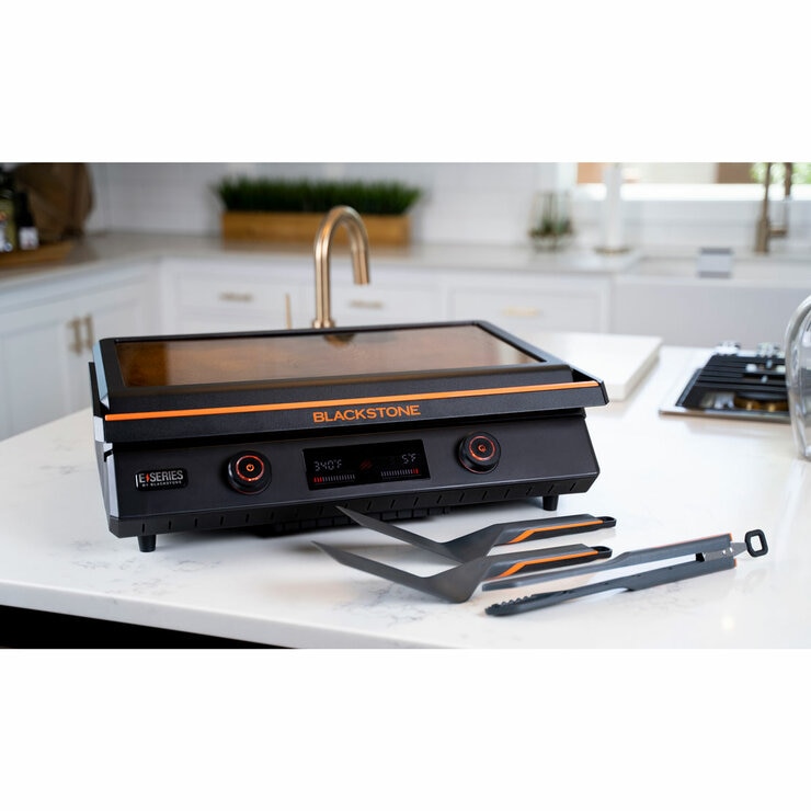 Lifestyle image of electric griddle closed on kitchen counter Lifestyle image of electric griddle closed on kitchen counter