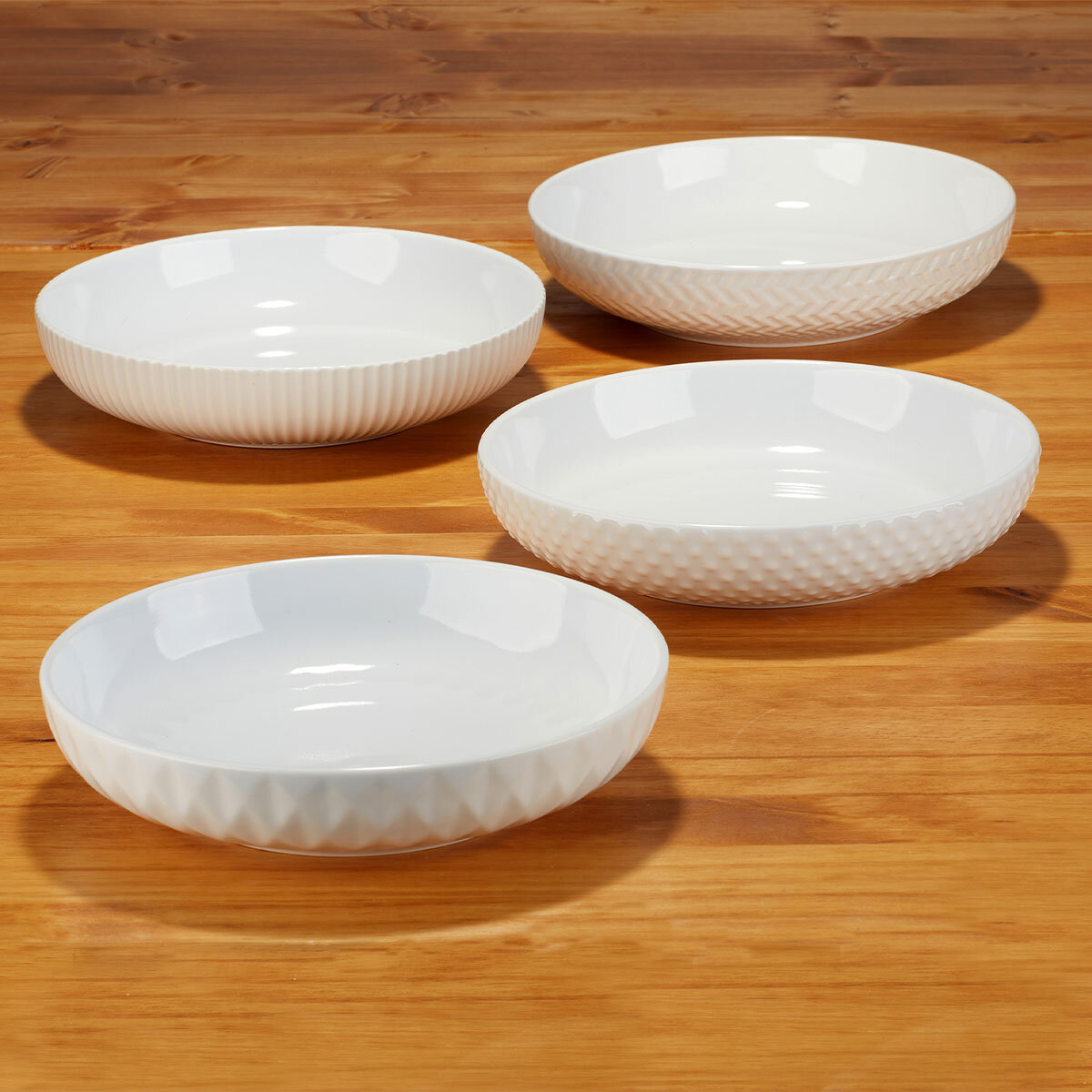 4 bowls laid out on table empty