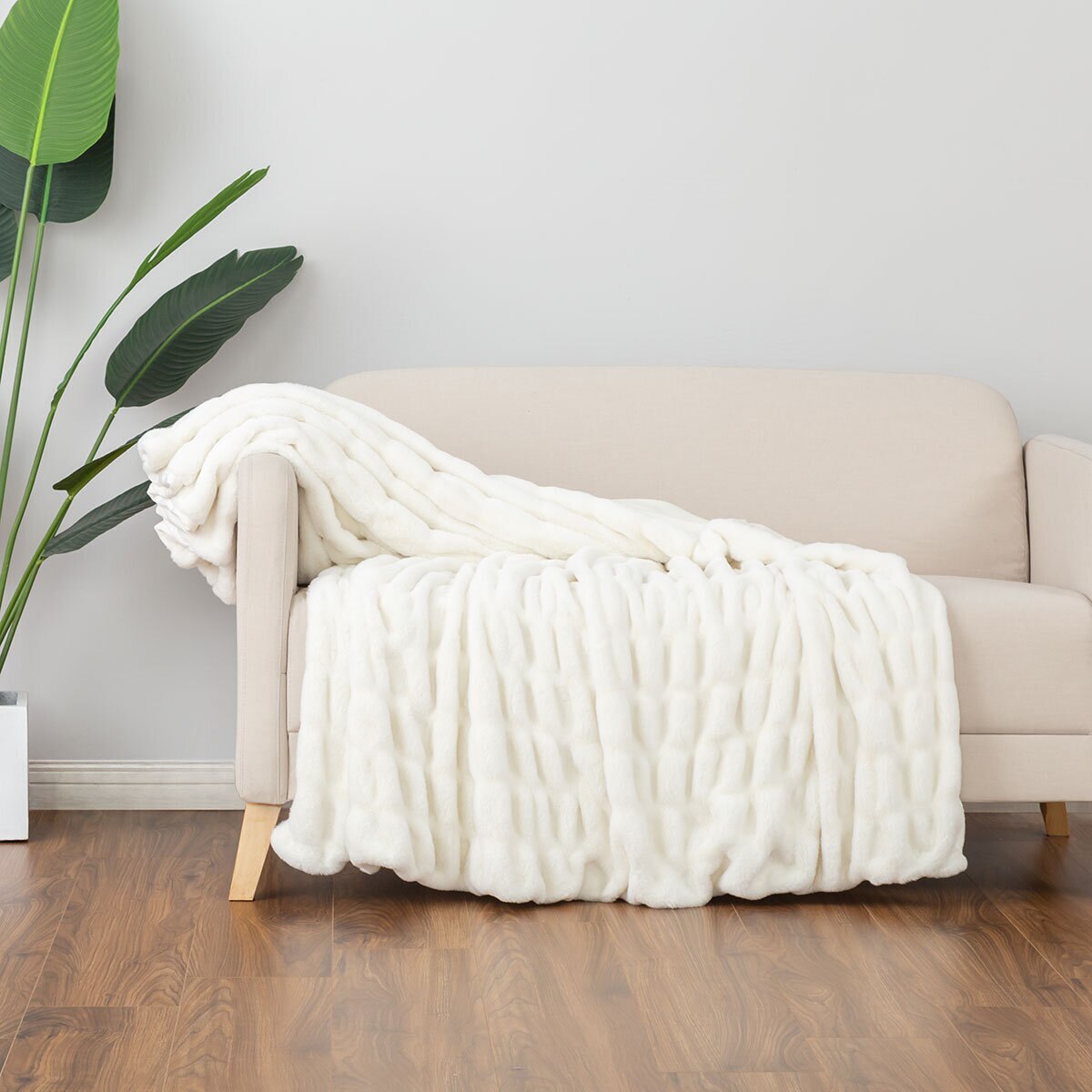 Textured faux fur throw on sofa