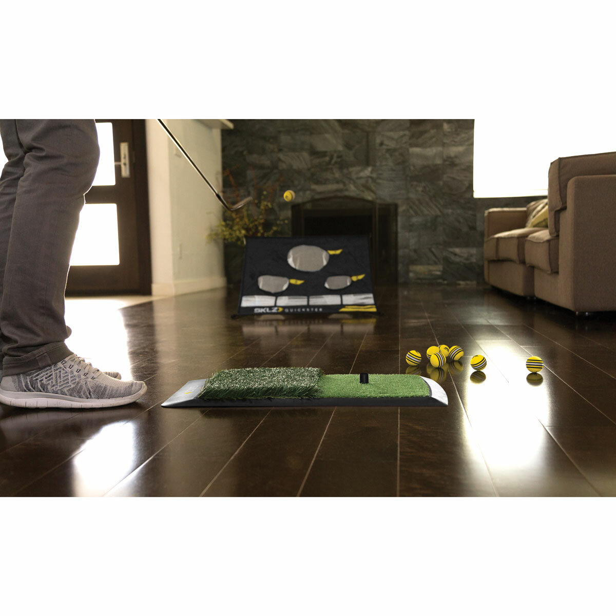 Lifestyle image of someone using the mat and balls indoors Lifestyle image of someone using the mat and balls indoors