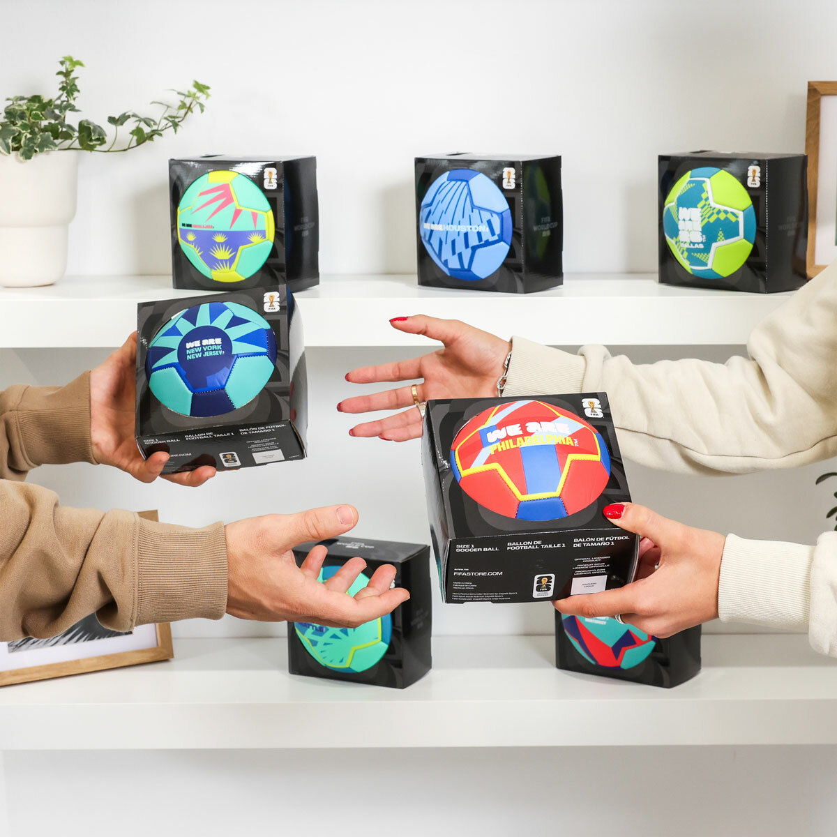 Lifestyle image of two people trading footballs