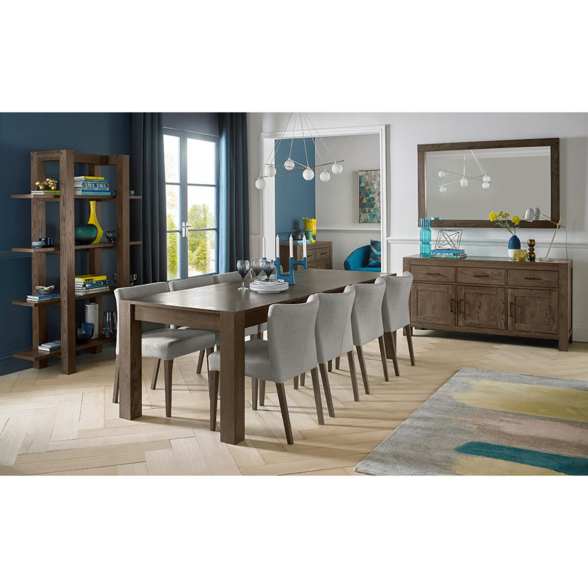 Lifestyle image of Milan Dingin table with low back upholstered chairs