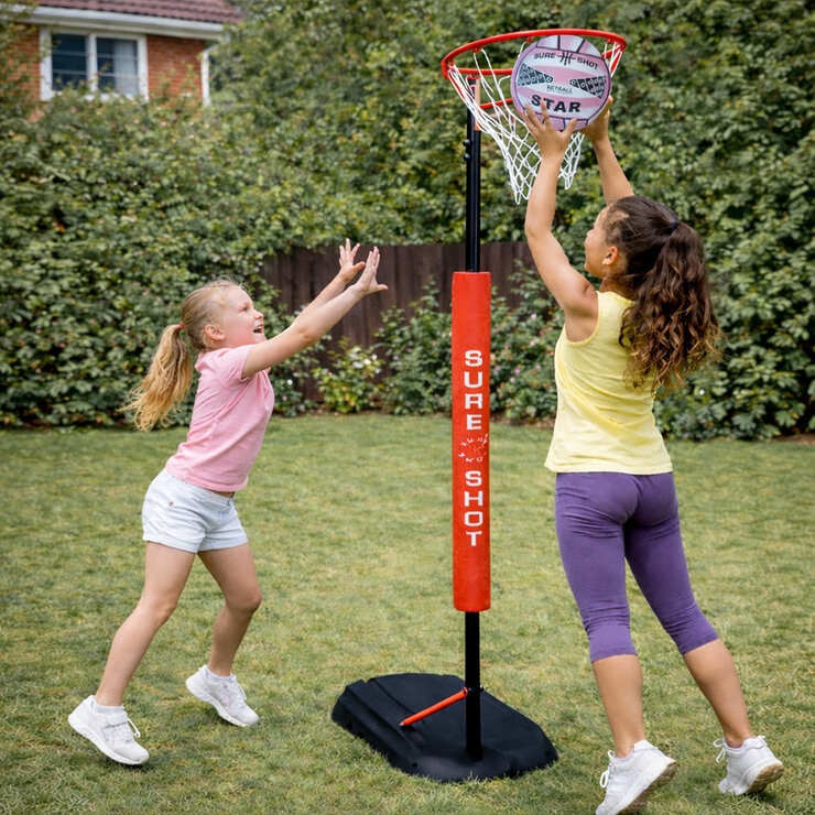 Lifestyle image of two girls playing netball