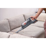 Lifestyle Image describing Black & Decker 18V POWERSERIES+ cleaning sofa