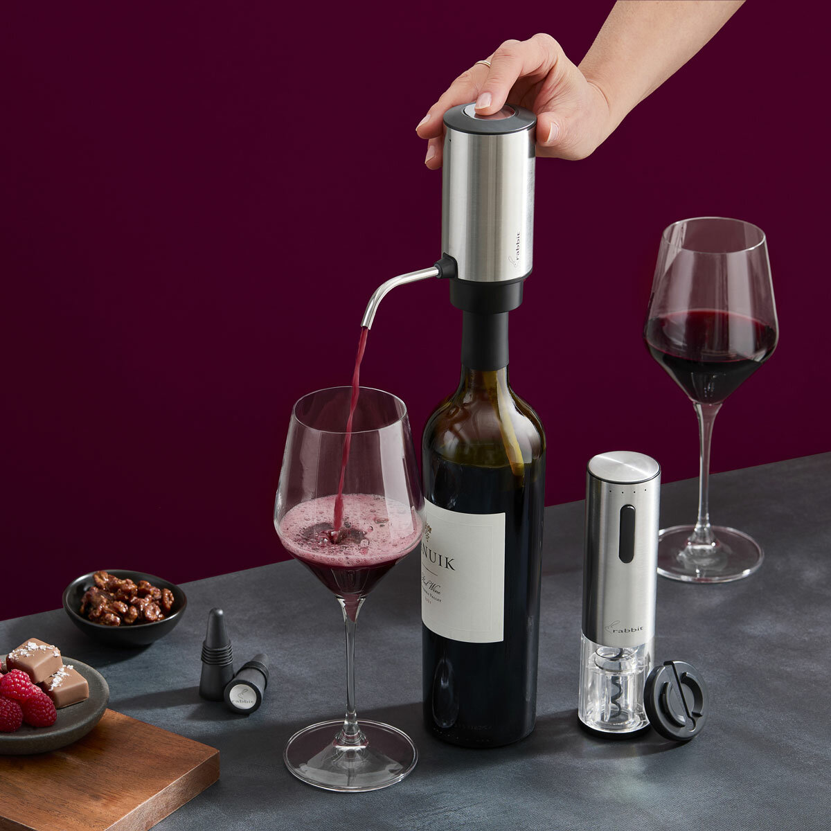 Lifestyle image of wine dispenser attachment being used