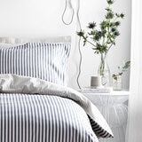 Blue and white vertically striped duvet set with matching