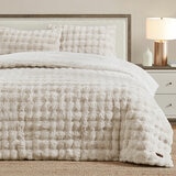 Cream bubble faux fur comforter set, including two decorative pillows styled on bed Cream bubble faux fur comforter set, including two decorative pillows styled on bed