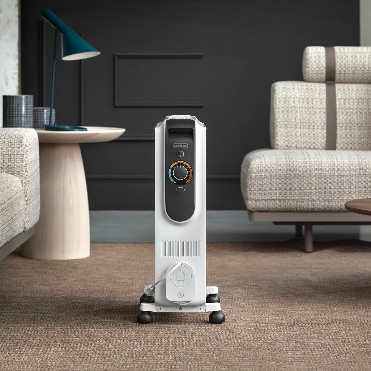 Lifestyle image of De'Longhi Oil Filled Radiator in a living room Lifestyle image of De'Longhi Oil Filled Radiator in a living room