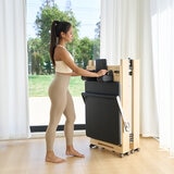 Lifestyle image of a woman folding the reformer away Lifestyle image of a woman folding the reformer away
