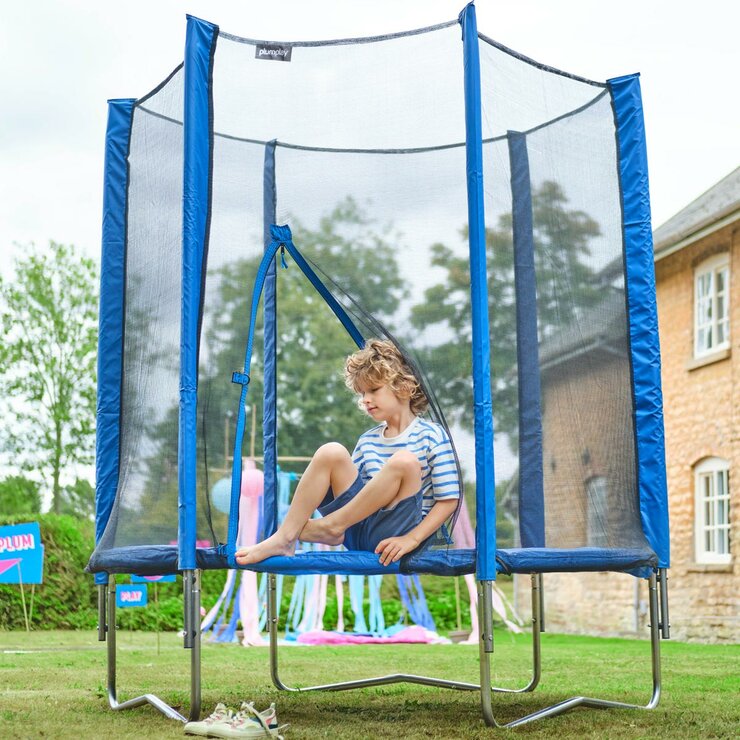 Lifestyle image of a child climbing out of the trampoline