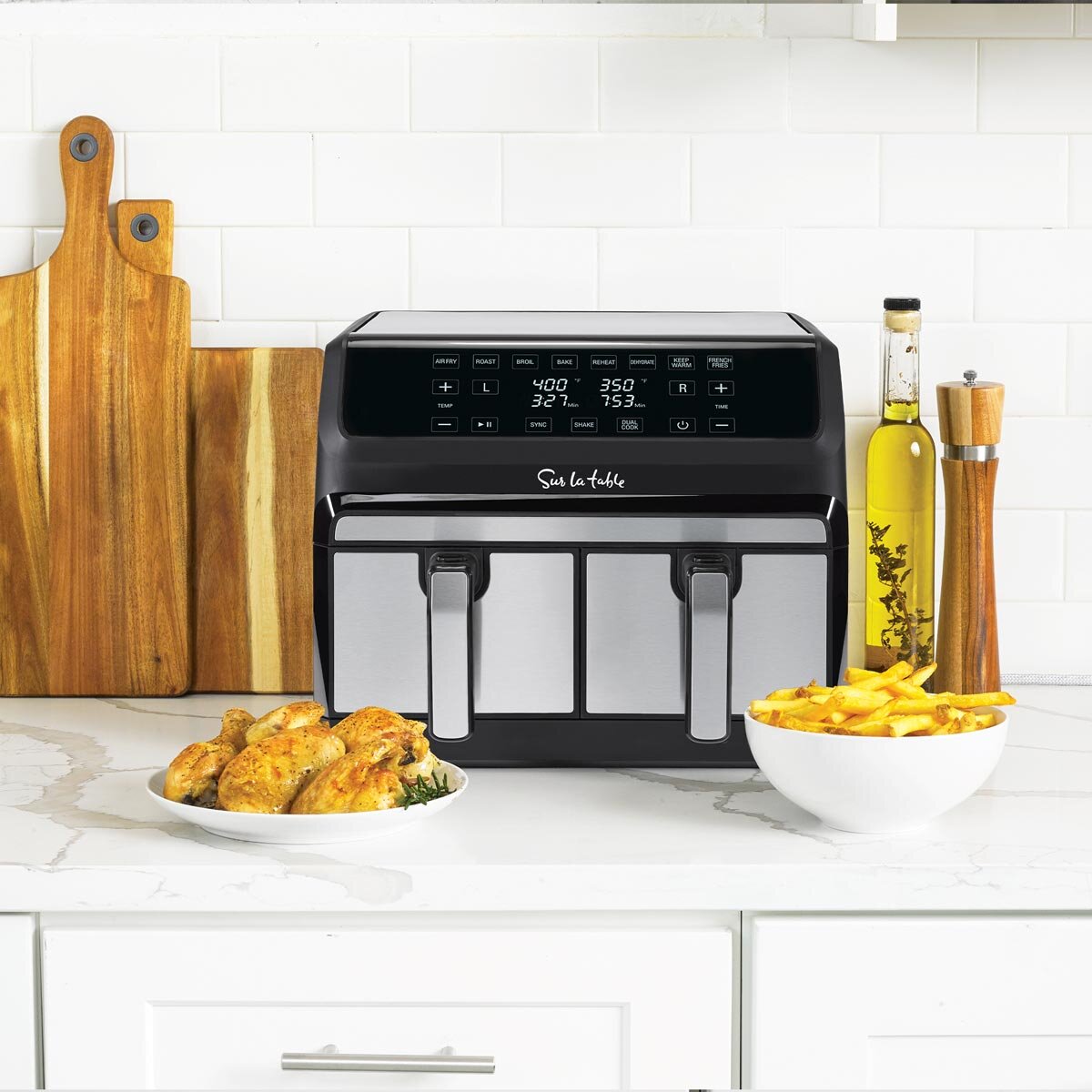 Lifestyle image of the front of sur la table dual basket air fryer