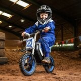 Lifestyle image of a child on the Xootz Cobolt Kids Electric Motorbike