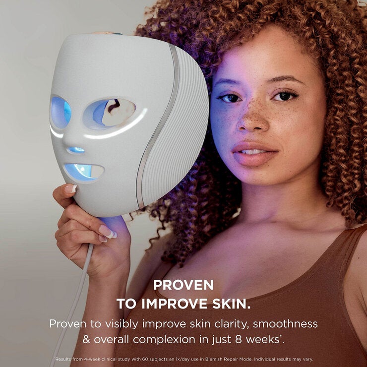 Lifestyle image of model holding the mask