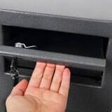 Close up image of drop slot on top of safe