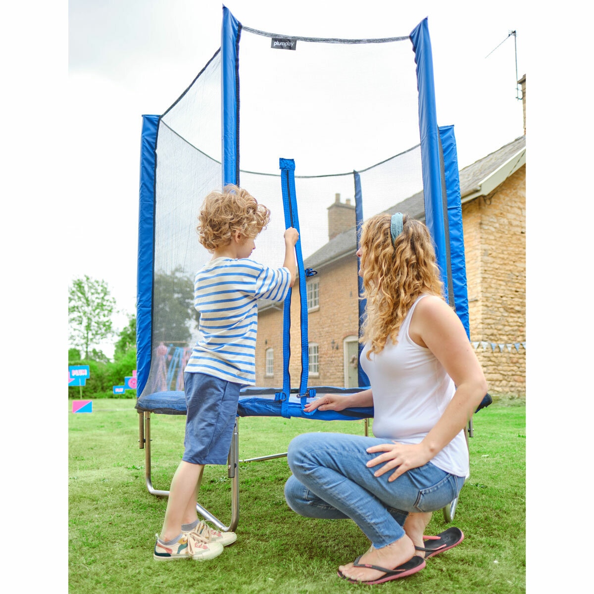 Lifestyle image of a child and mother using the zip