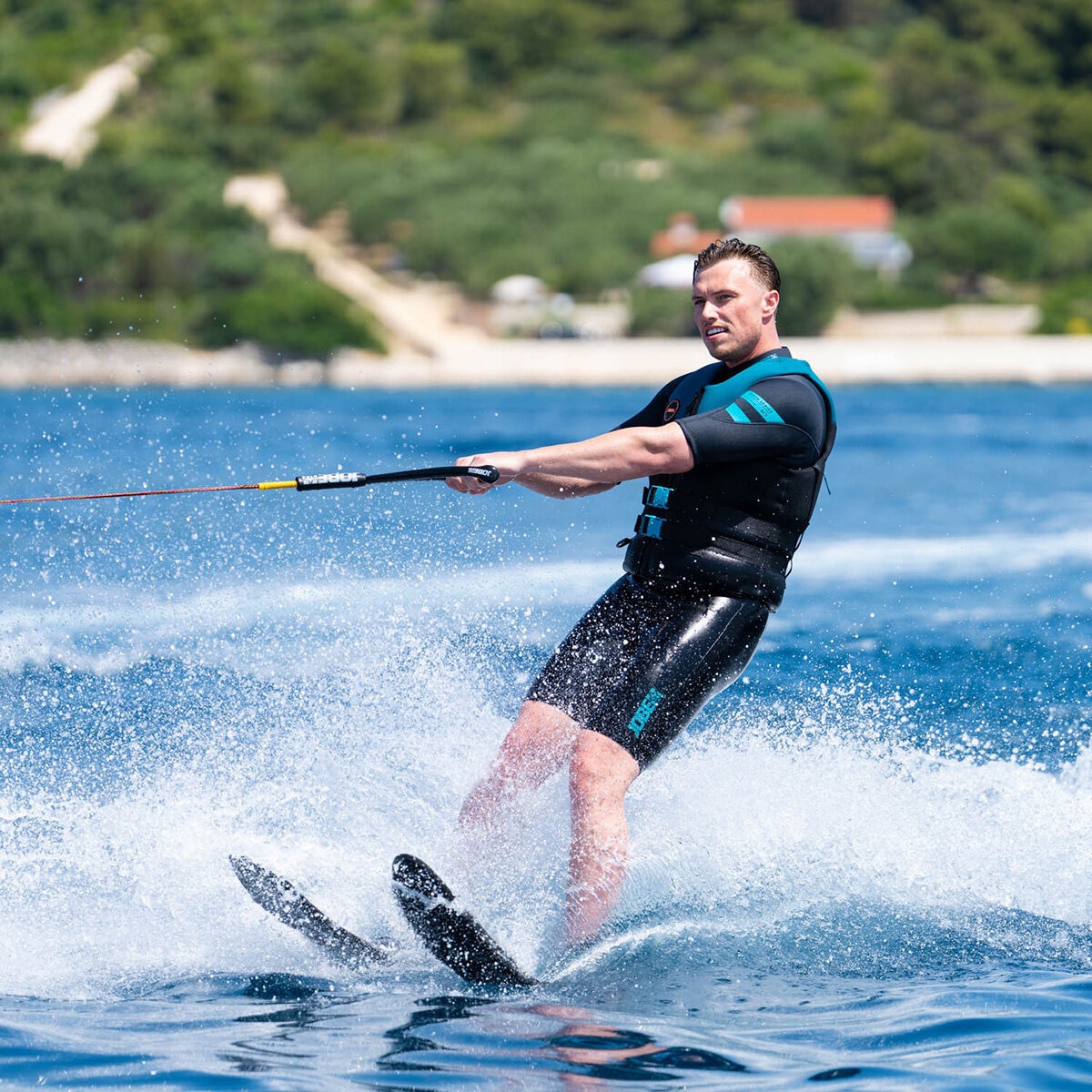 Lifestyle image of a man using the Allegre Combo Waterskis Lifestyle image of a man using the Allegre Combo Waterskis