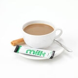 Milk Stick next to a Cup of Tea