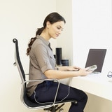 A Woman Using Product at a Desk