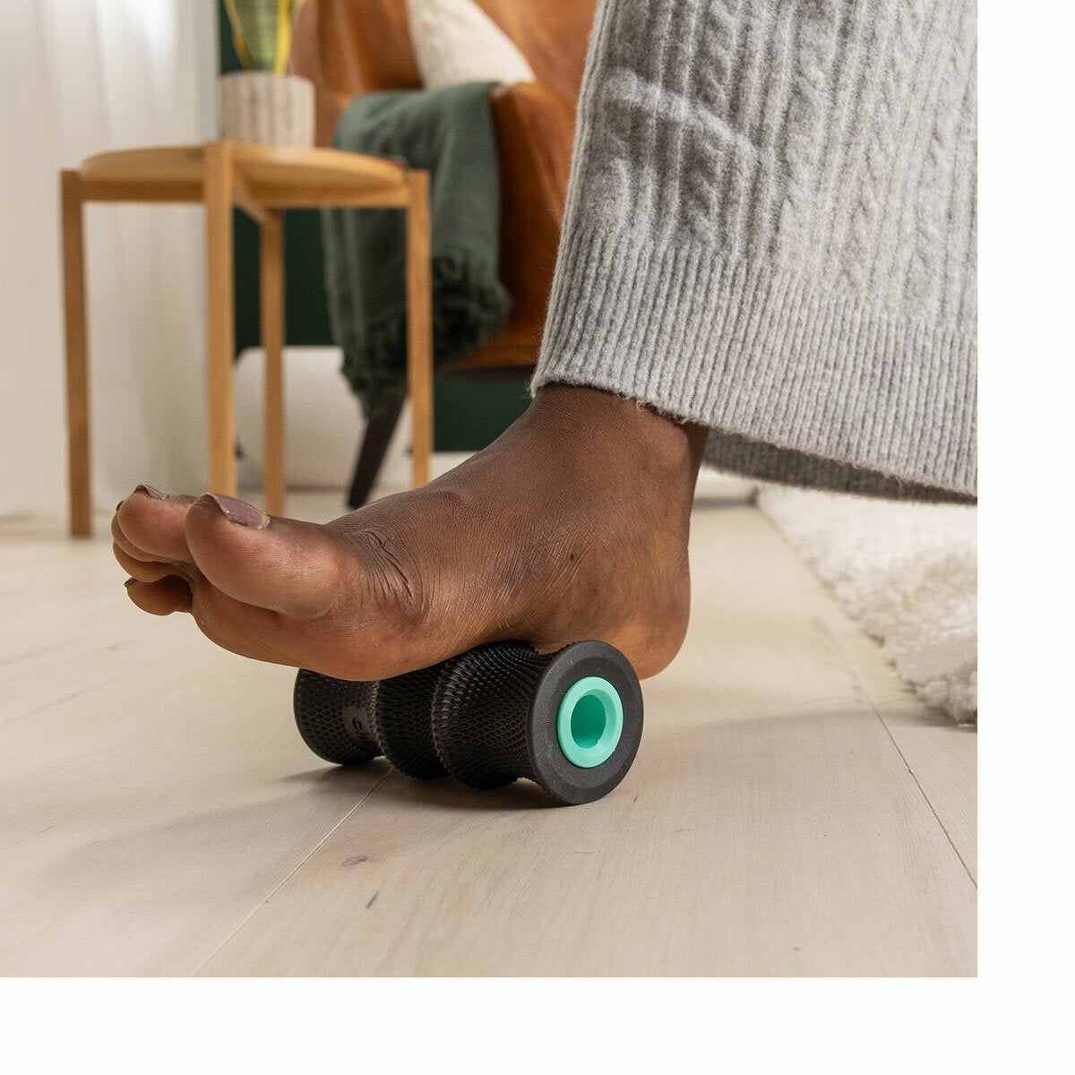 Lifestyle image of a person using a wheel on their foot