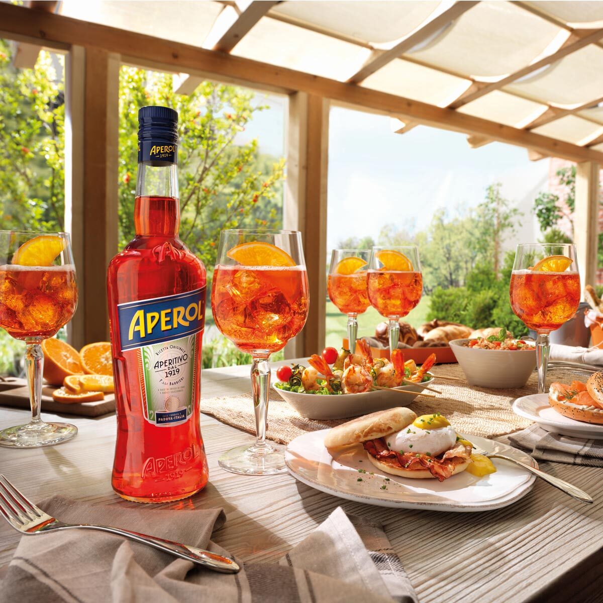Aperol Bottle glasses in a brunch setting