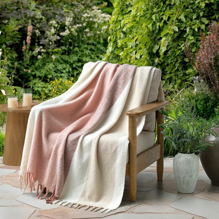 Pink throw draped on chair
