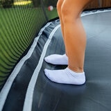 Lifestyle image of a child jumping on the edge of the trampoline Lifestyle image of a child jumping on the edge of the trampoline