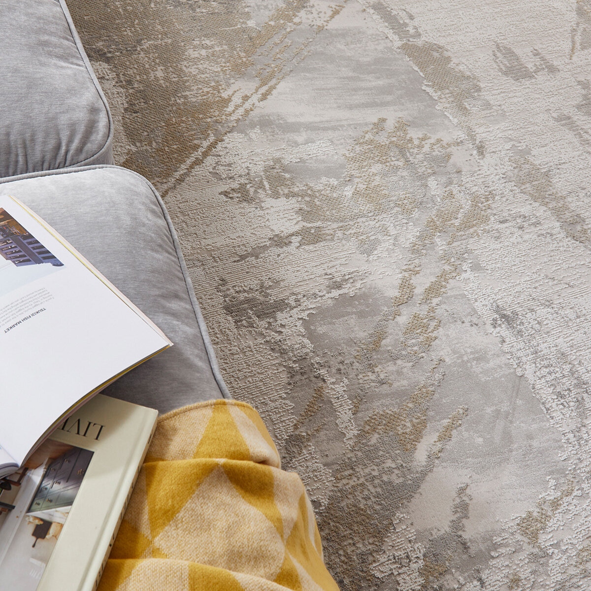 Modern abstract rug in grey, beige and white with painterly, marbled design.