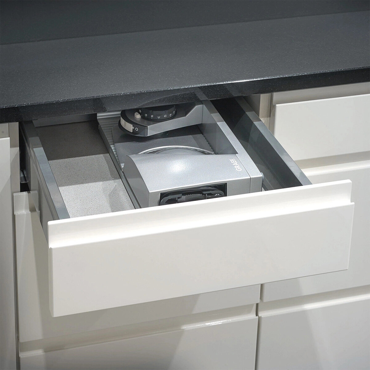 Lifestyle image of Graef Mytiny Foldable Food Slicer in a drawer Lifestyle image of Graef Mytiny Foldable Food Slicer in a drawer