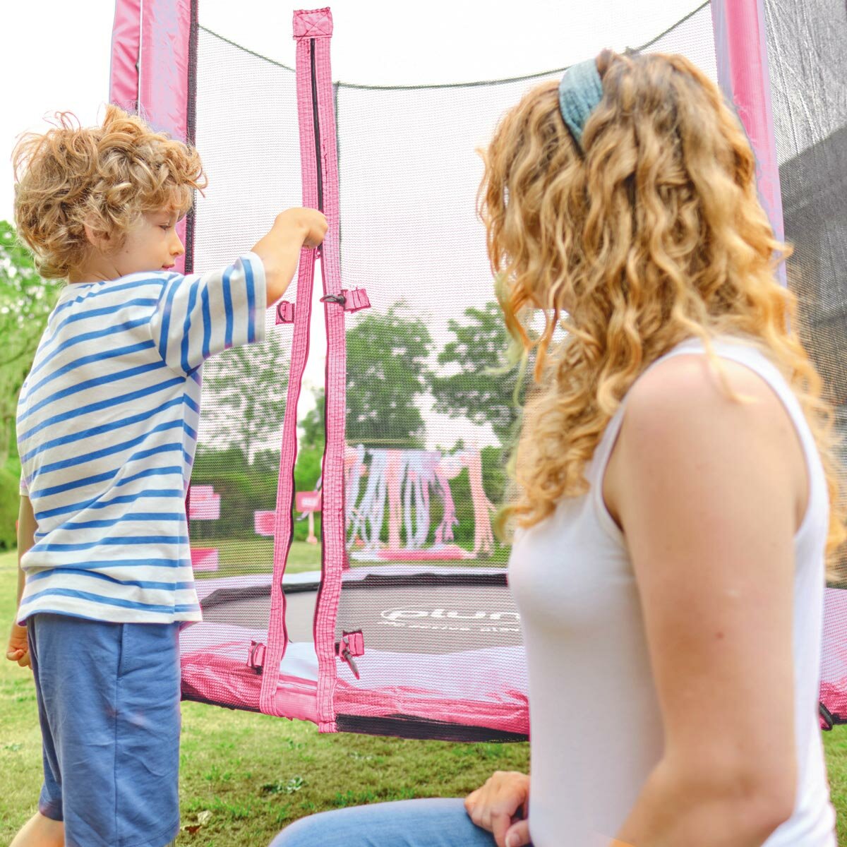 Lifestyle image of a child and mother using the zip