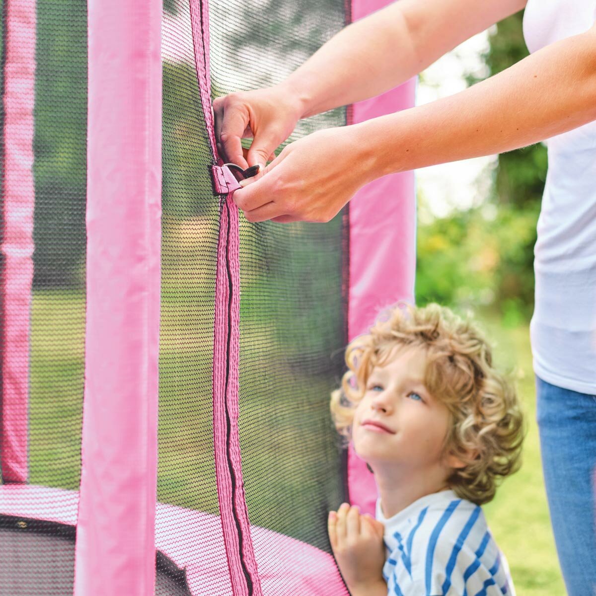 Lifestyle image of someone using the clips on the trampoline
