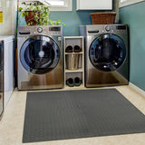 Lifestyle Image in a small room with two washing machines and linyl flooring underneath