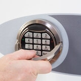 Close up image of electronic keypad on white background