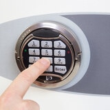 Close up image of electronic keypad on white background