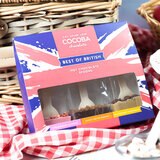 Cocoba Best Of British, Hot Chocolate Spoons, surrounded by cakes and fruit