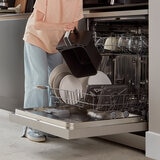 Lifestyle image of dishwasher safe parts being put into a dishwasher Lifestyle image of dishwasher safe parts being put into a dishwasher