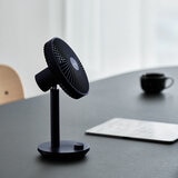 Lifestyle image of Lumena Wireless Stand Fan in navy Lifestyle image of Lumena Wireless Stand Fan in navy