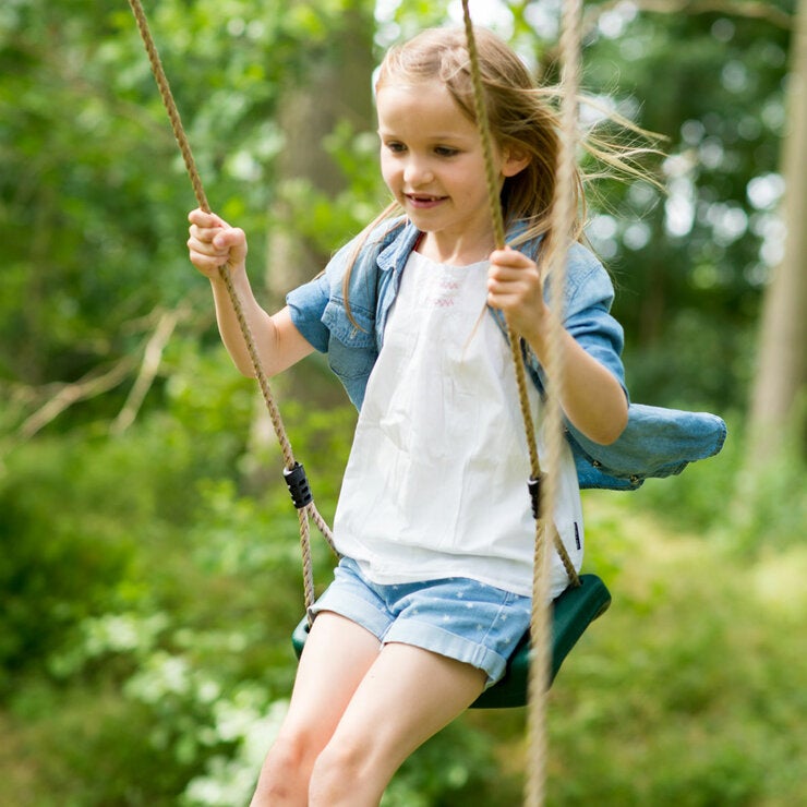 A lifestyle image of a child on a swing A lifestyle image of a child on a swing
