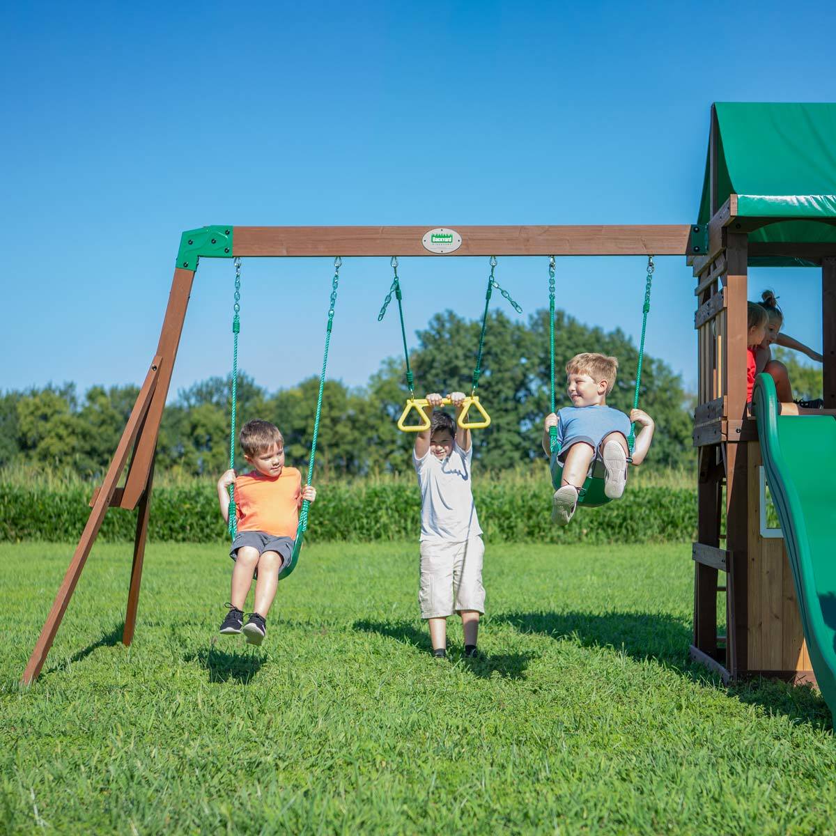 The Lakewood Swing set playcenter with children swinging