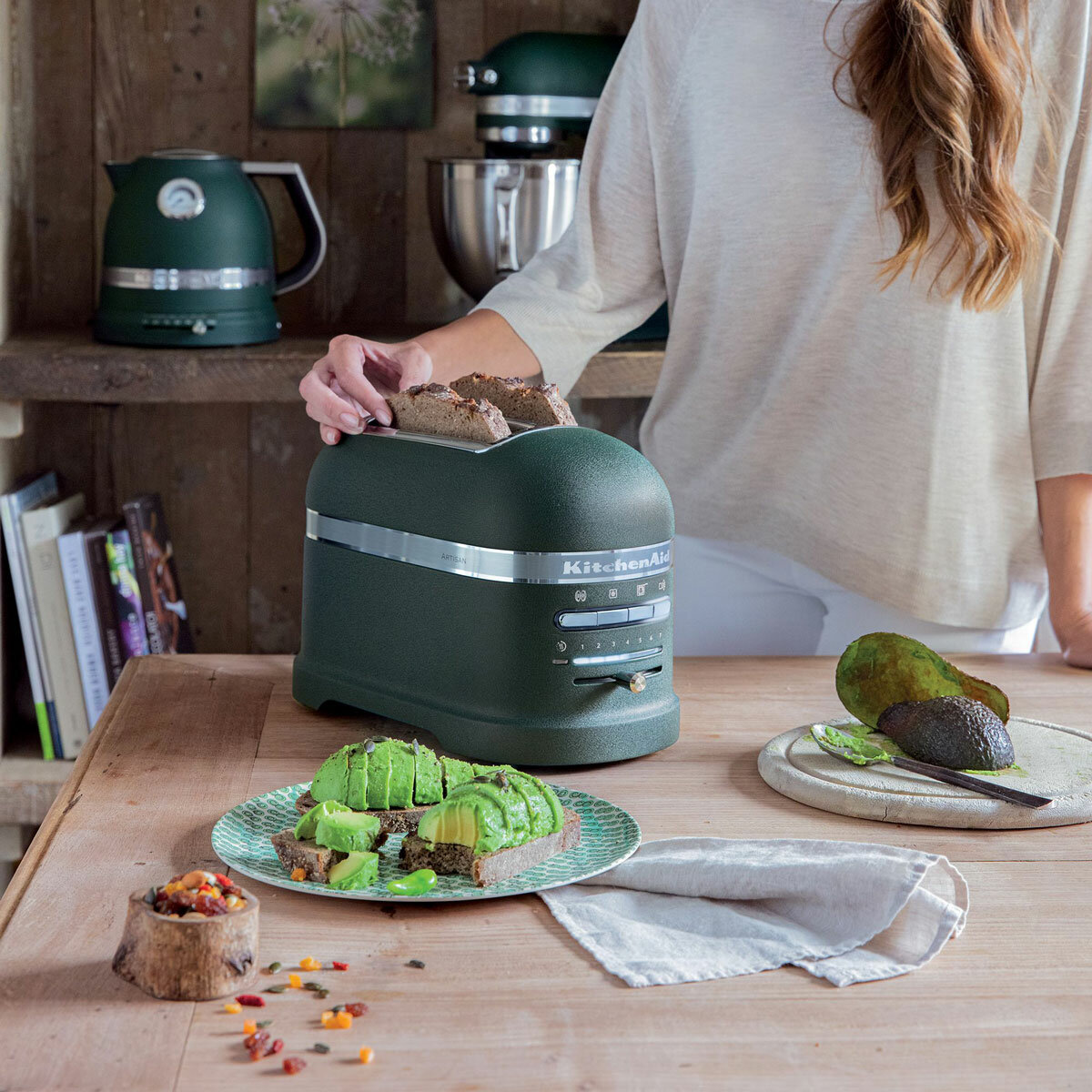 Lifestyle image of KitchenAid Artisan slot toaster being used