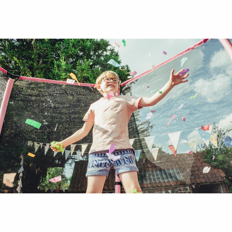 Lifestyle image of a child jumping on the trampoline