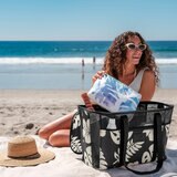 Lifestyle image of a woman putting items into the bag Lifestyle image of a woman putting items into the bag