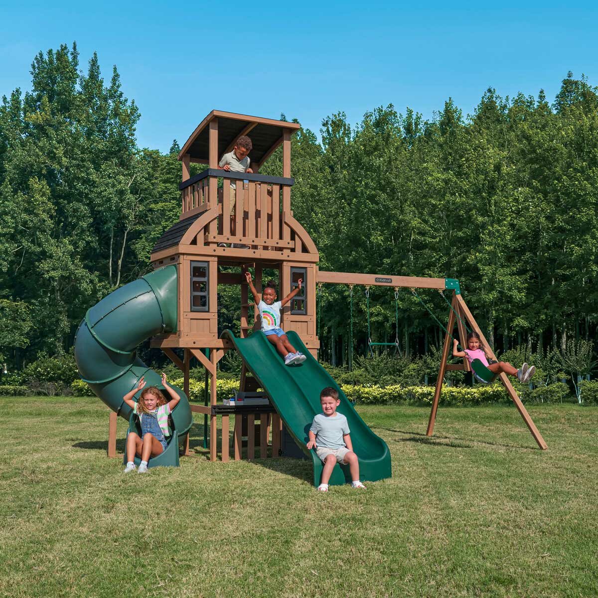 Lifestyle image of children playing on the KidKraft Summit Vista Playcentre and Swing Set Lifestyle image of children playing on the KidKraft Summit Vista Playcentre and Swing Set