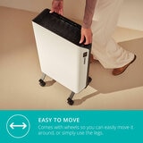 Lifestyle image of Edge Oil Smart Heater 2000W with wheels making it easy to move