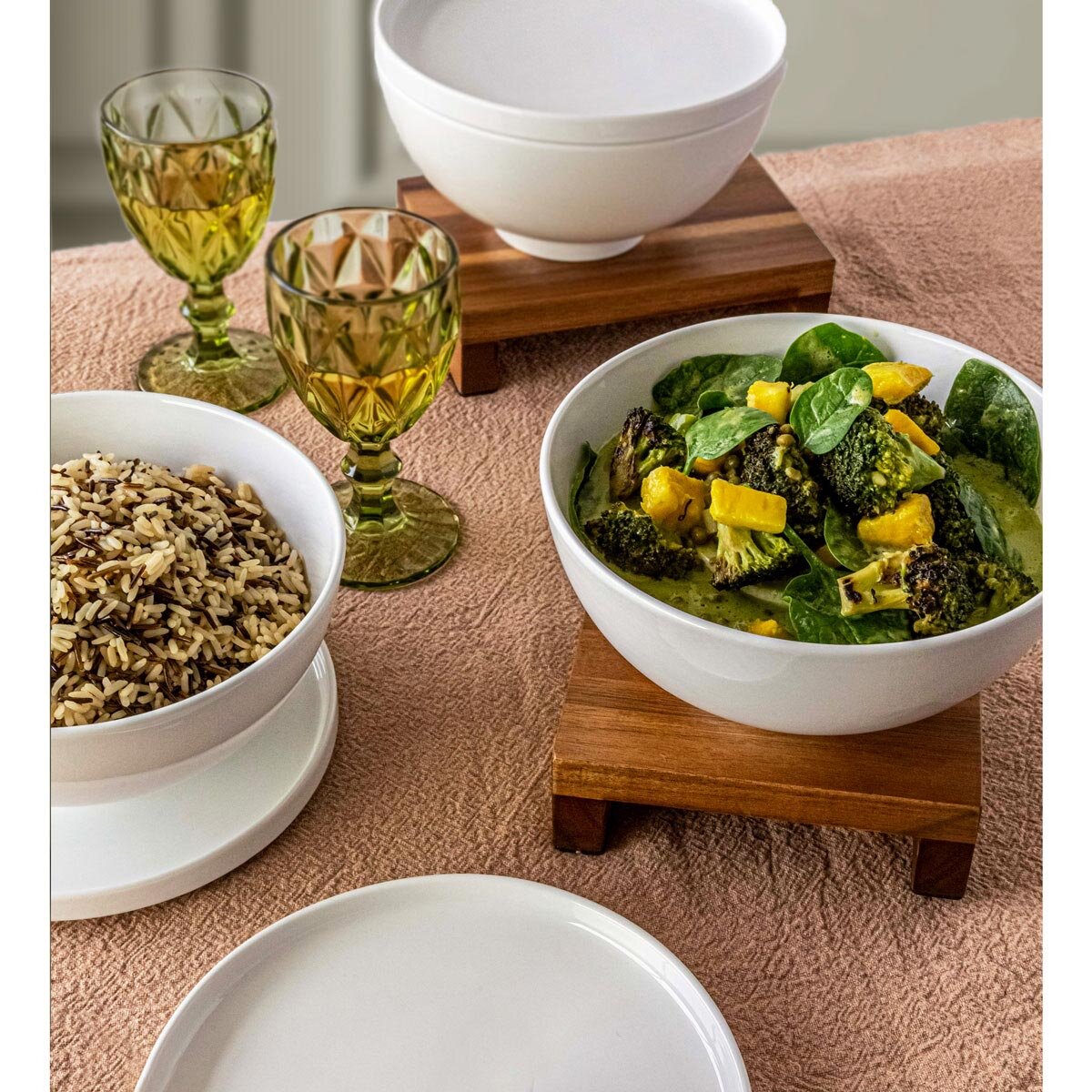 lifestyle image of bowls with plates and lids