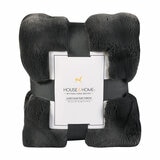 Dark grey faux fur throw packaged with ribbon and branded label