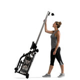 image of person holding rower upright