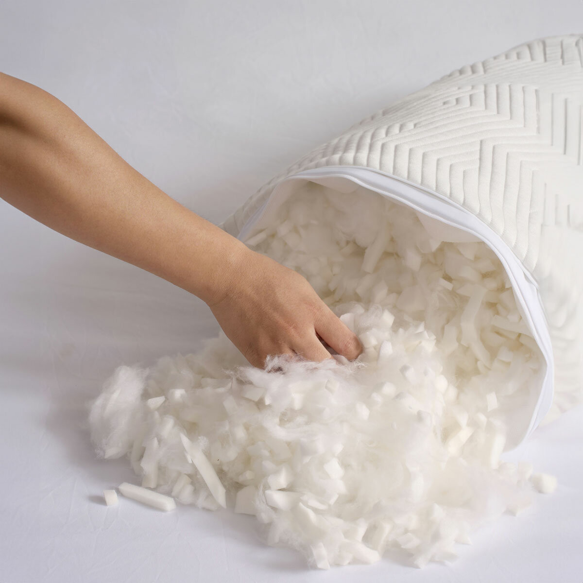 Pillow shown unzipped to reveal shredded foam and fibre filling, Customisable firmness