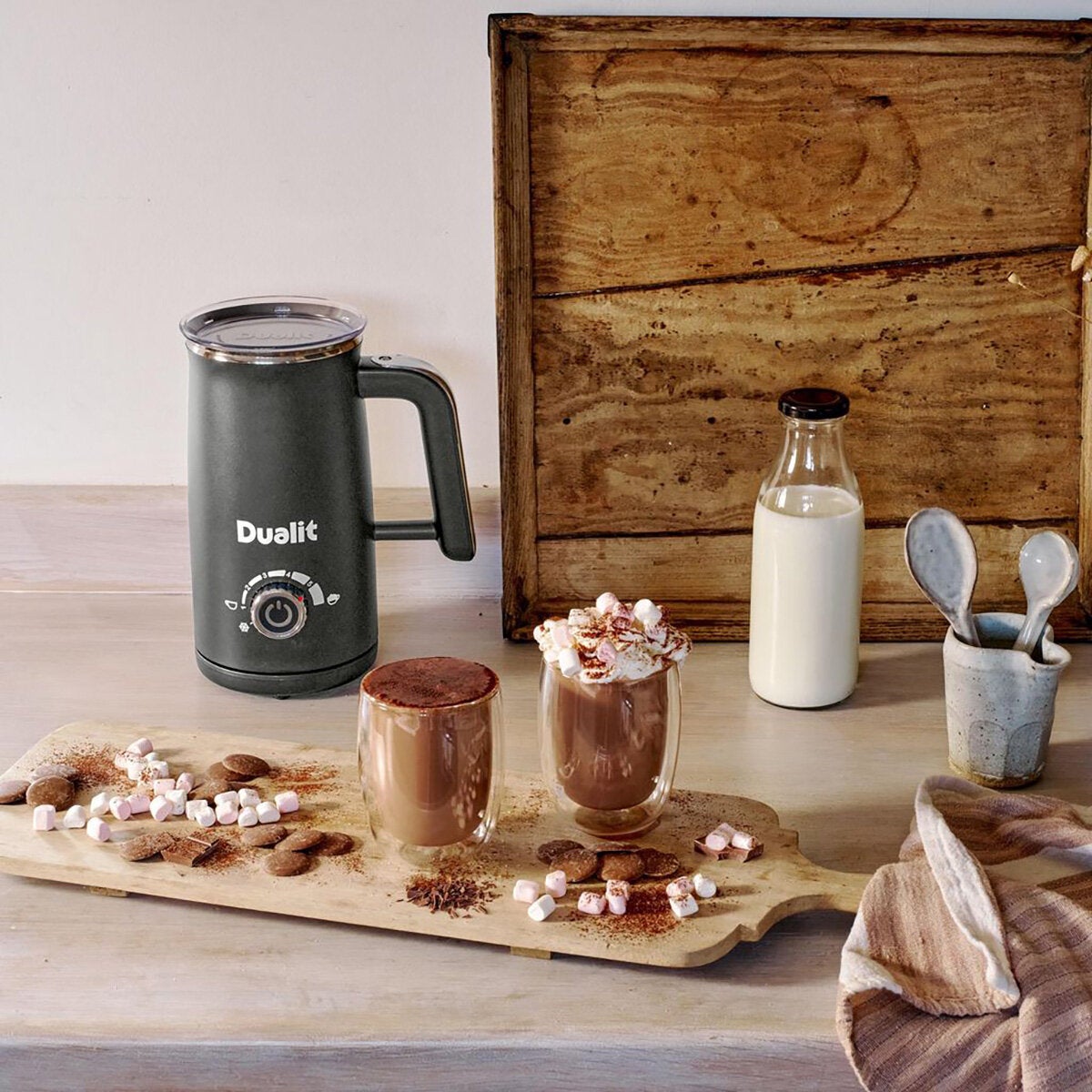 Life style image of 2 filled hot chocolate cups and hot chocolate maker Life style image of 2 filled hot chocolate cups and hot chocolate maker