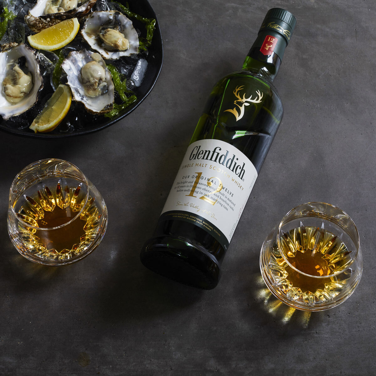 Lifestyle image of bottle served with oysters